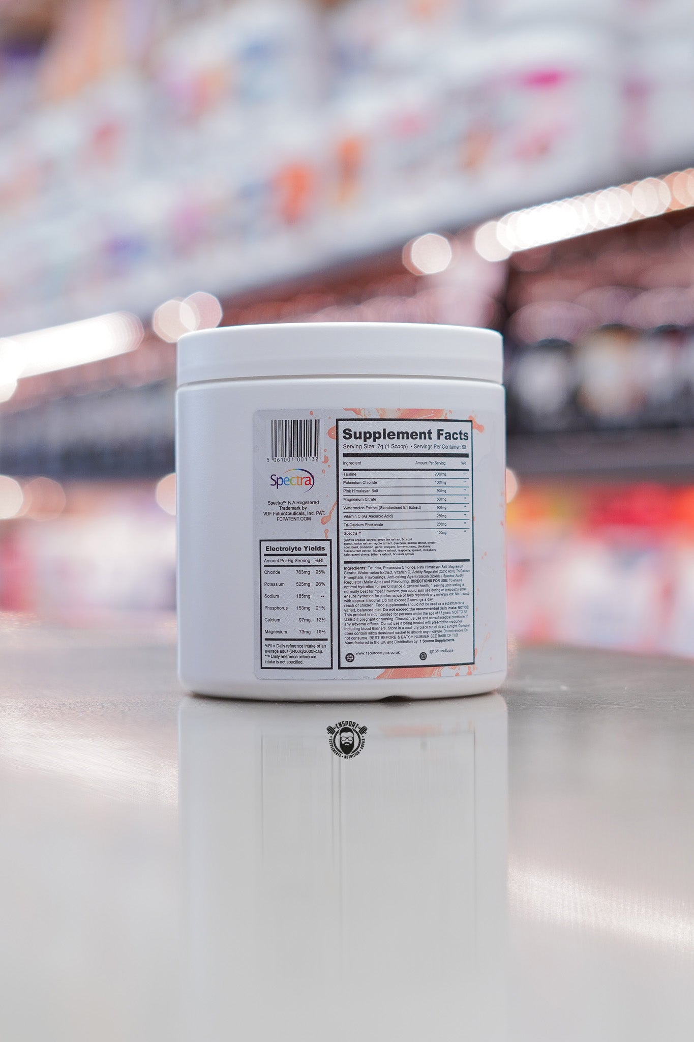 Back of 1 Source Supplements Hydrate advanced hydration powder tub showing supplement facts and electrolyte panel, photographed on a retail counter.