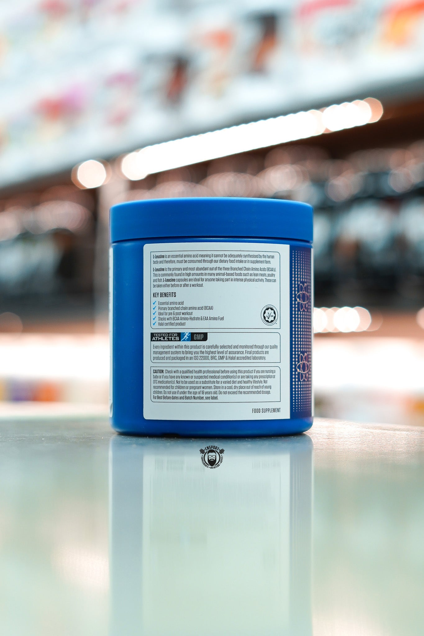 Side of Applied Nutrition Leucine 4K container showing product benefits including BCAA content, vegan suitability, Informed-Sport certification, and cautionary text.