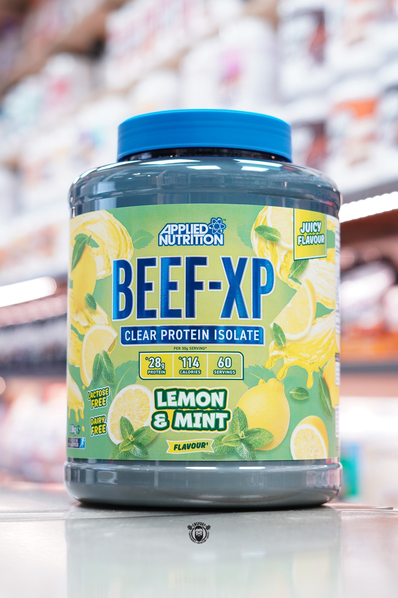 Front of Applied Nutrition Beef-XP Lemon & Mint flavour protein isolate with bright citrus-themed design, 28g protein per serving, 60 servings.
