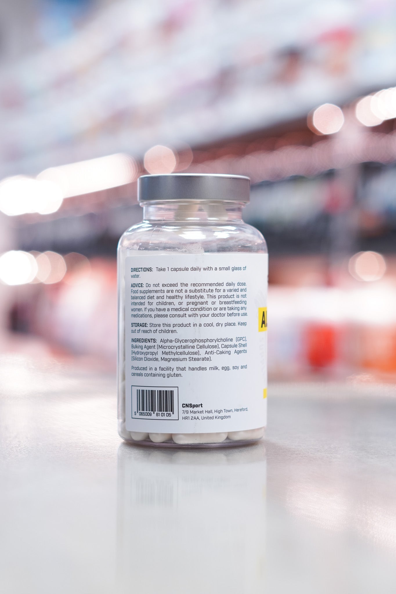 CNSport Alpha-GPC 300mg supplement side label with usage directions, ingredient list, and barcode visible