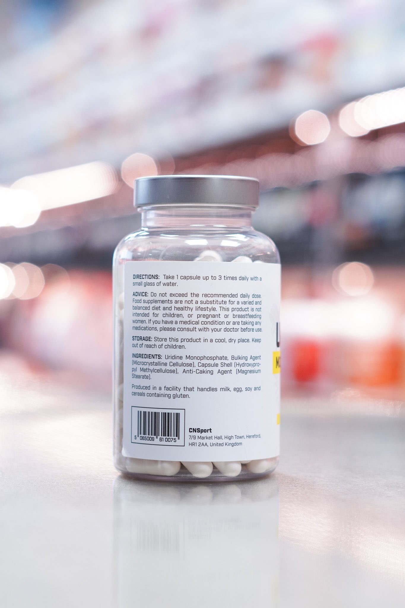 Rear label of CNSport Uridine Monophosphate supplement detailing usage instructions, cautionary advice, and full ingredient list including microcrystalline cellulose and magnesium stearate.