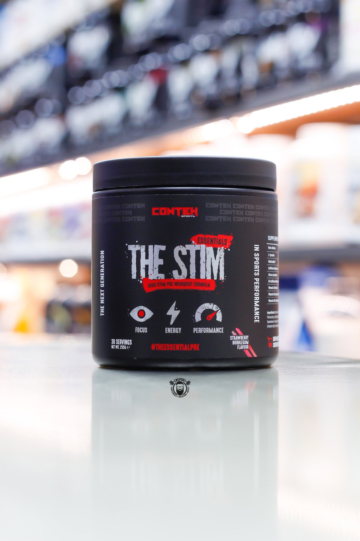 Conteh Sports The Stim pre-workout, Strawberry Bubblegum flavour, 30 servings (255g) black tub front view on supplement store counter.
