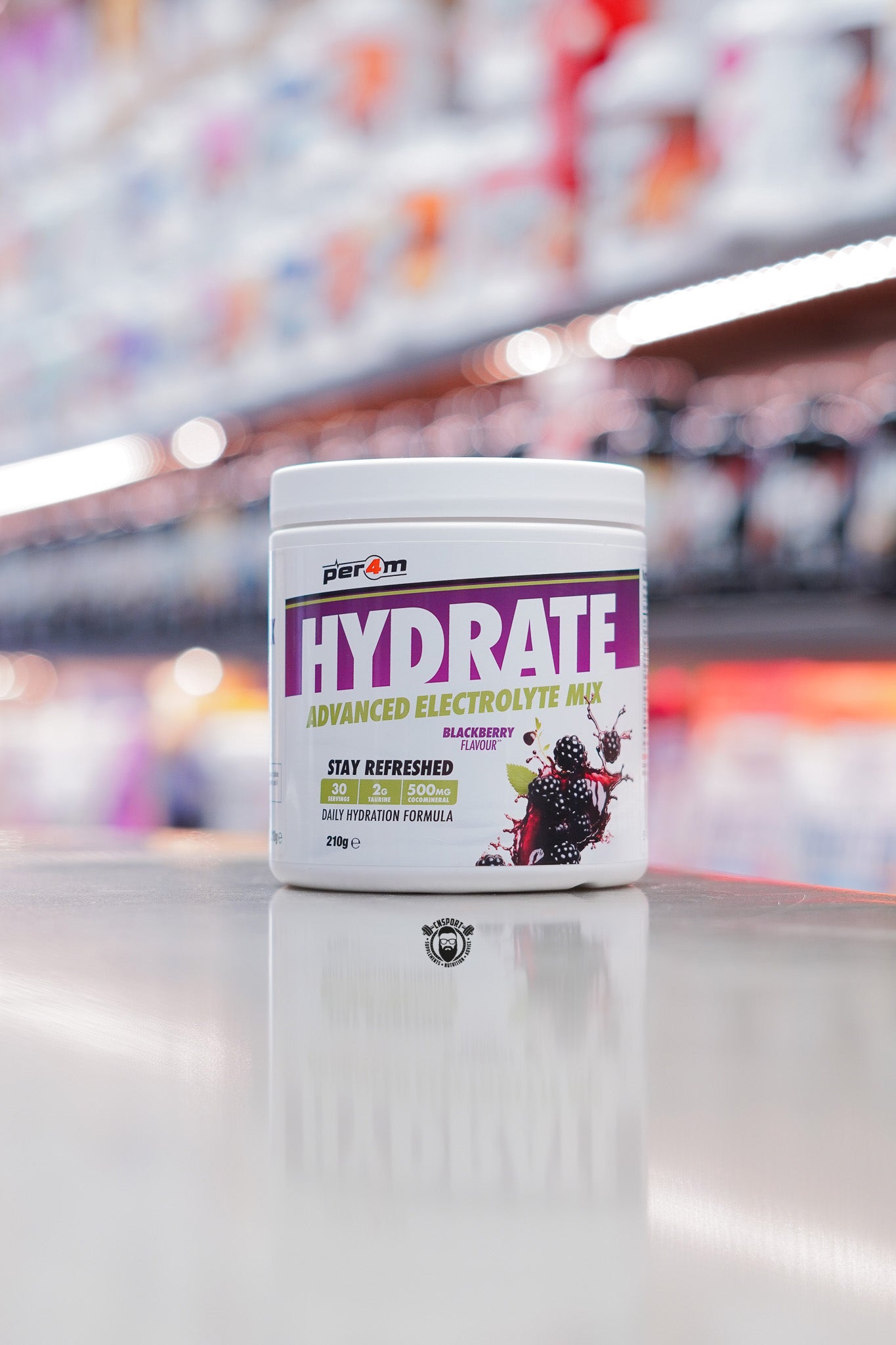 A tub of Per4m Hydrate advanced electrolyte mix in Blackberry flavour, a daily hydration formula designed to support fluid balance and refreshment.