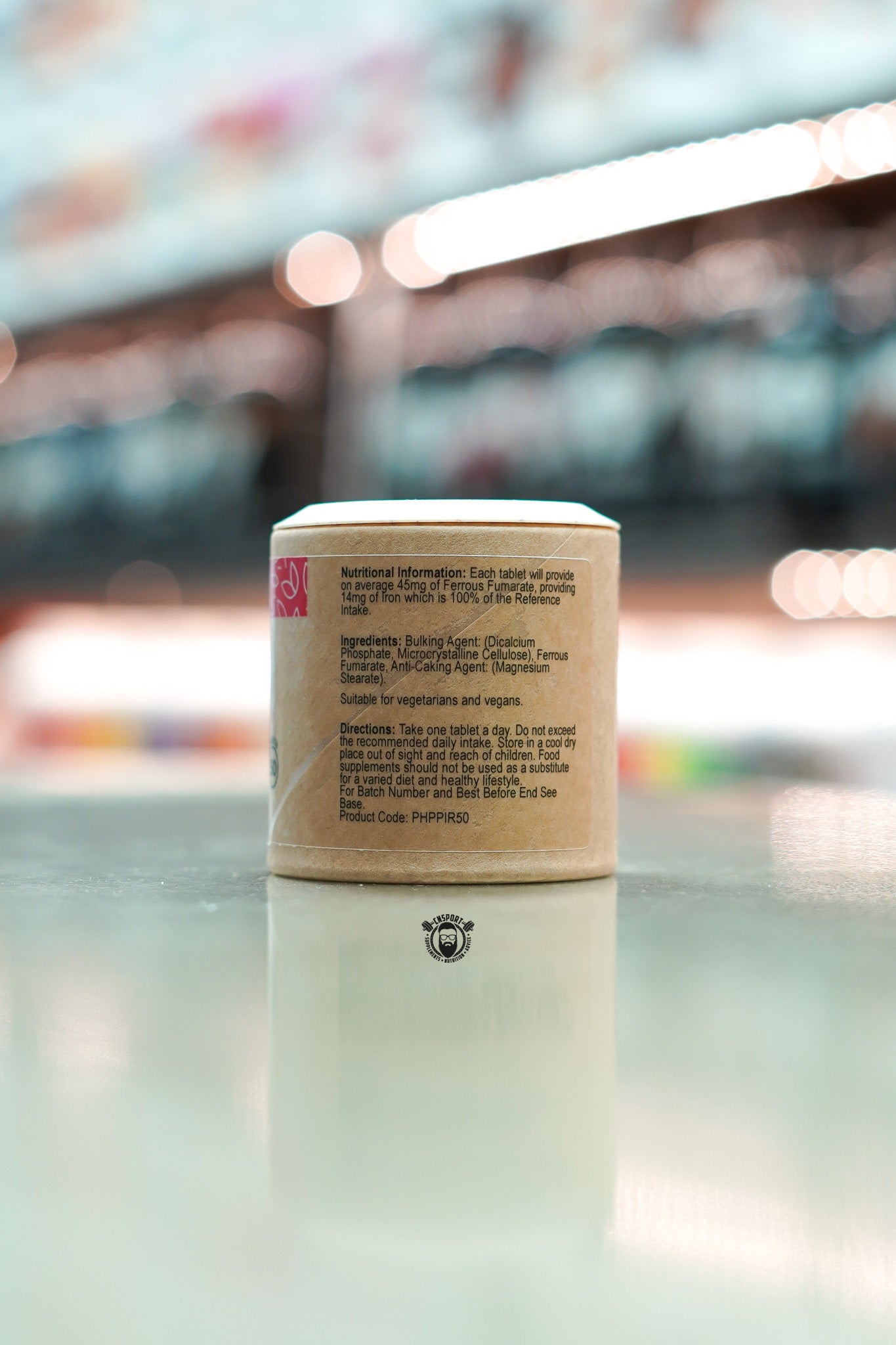 Back view of Power Health Iron supplement showing nutritional information, ingredients, and usage directions on a kraft-style label.