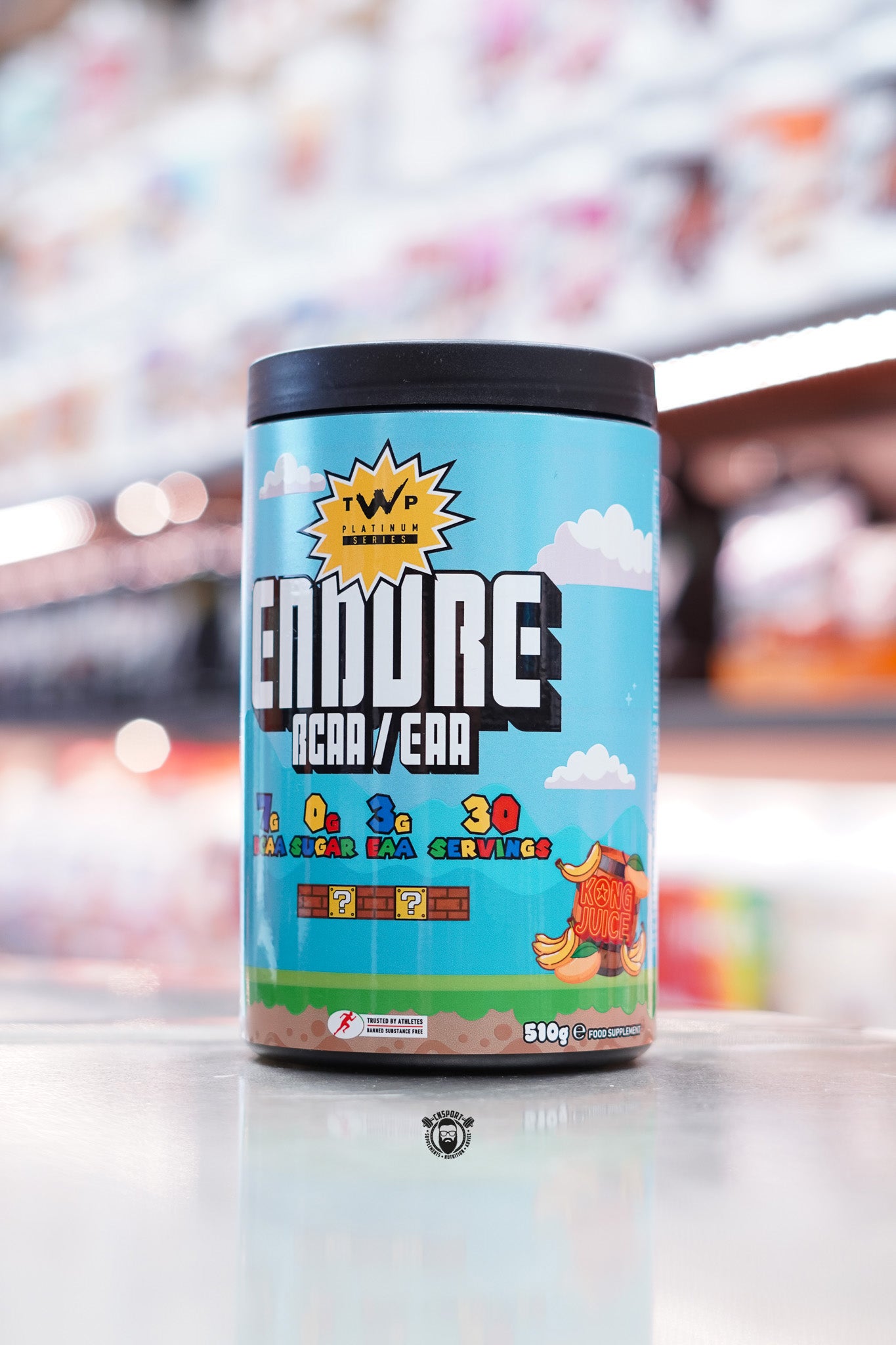 Alternate view of the Kong Juice tub, continuing the playful video game theme with additional clouds, bananas, and brick blocks. Highlights same nutritional specs and branding as side 1.