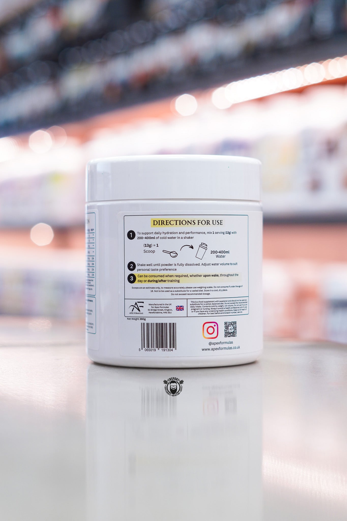 Side panel of Apex Formulas Apex Hydrate Iced Lemon showing directions for use, serving instructions, barcode, manufacturer information, QR code, and daily hydration guidance.