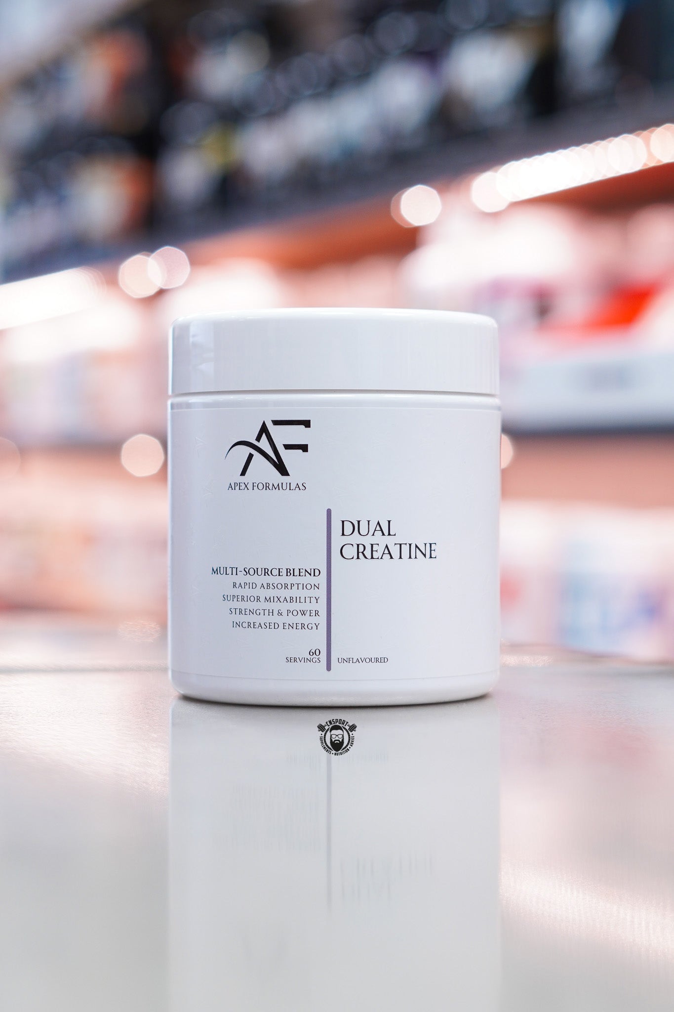 Apex Formulas Dual Creatine unflavoured multi-source creatine blend, 60 servings, white tub on supplement store counter.