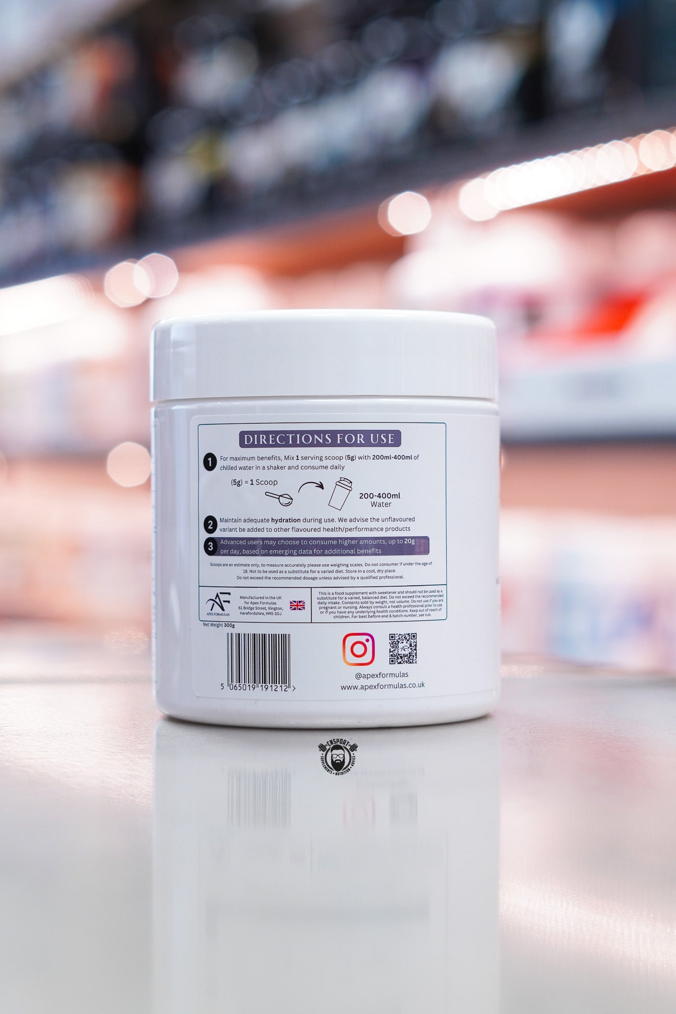 Apex Formulas Dual Creatine directions for use label with mixing instructions and serving guidance on white tub.