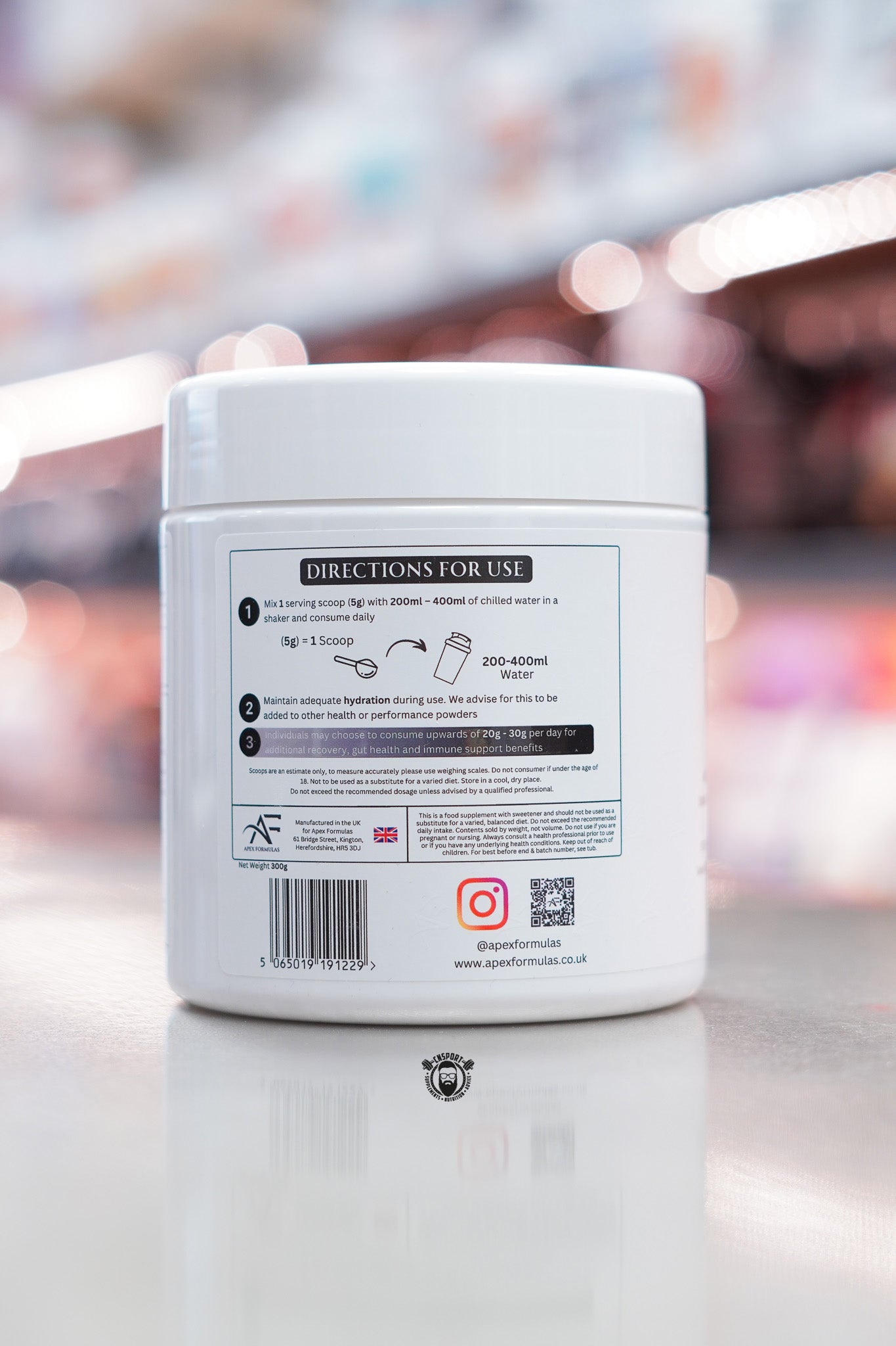 Apex Formulas Glutamine tub showing directions for use and mixing instructions, 5g scoop per serving, 60 servings.