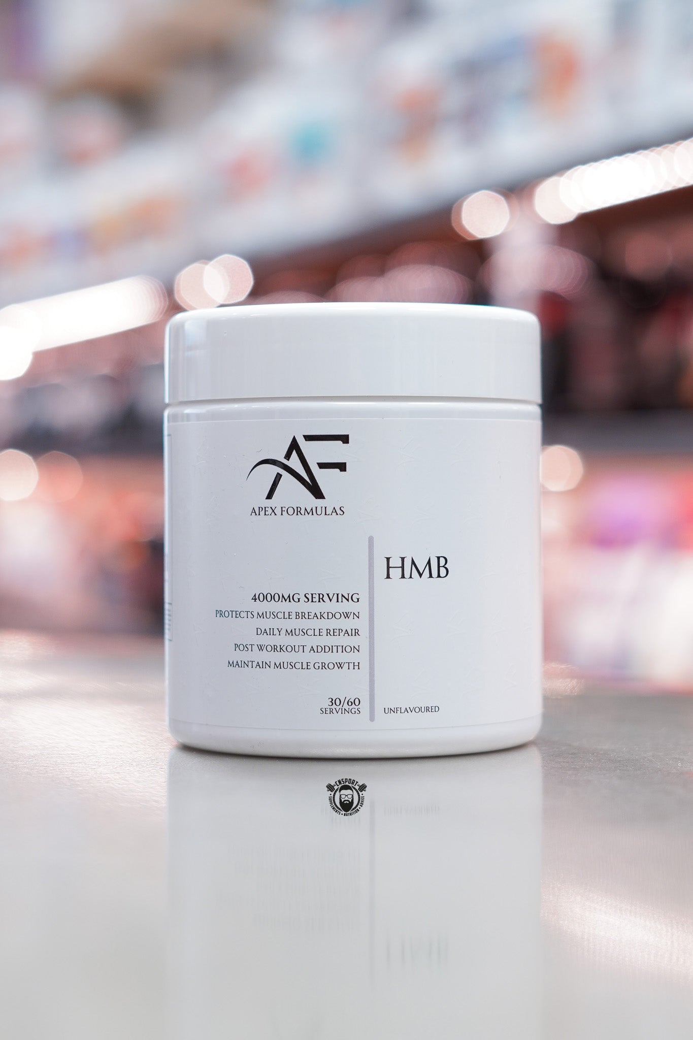 Apex Formulas HMB powder, unflavoured, 4000mg per serving, 30/60 servings, white tub displayed on supplement store counter.