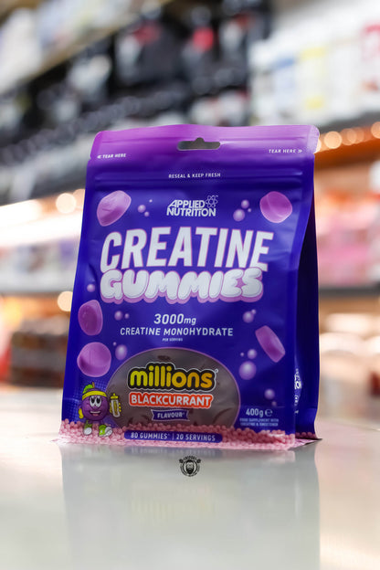 A pack of Applied Nutrition Creatine Gummies in blue packaging with a purple lid, displaying the product name and the fact that it contains 3000mg of creatine monohydrate.