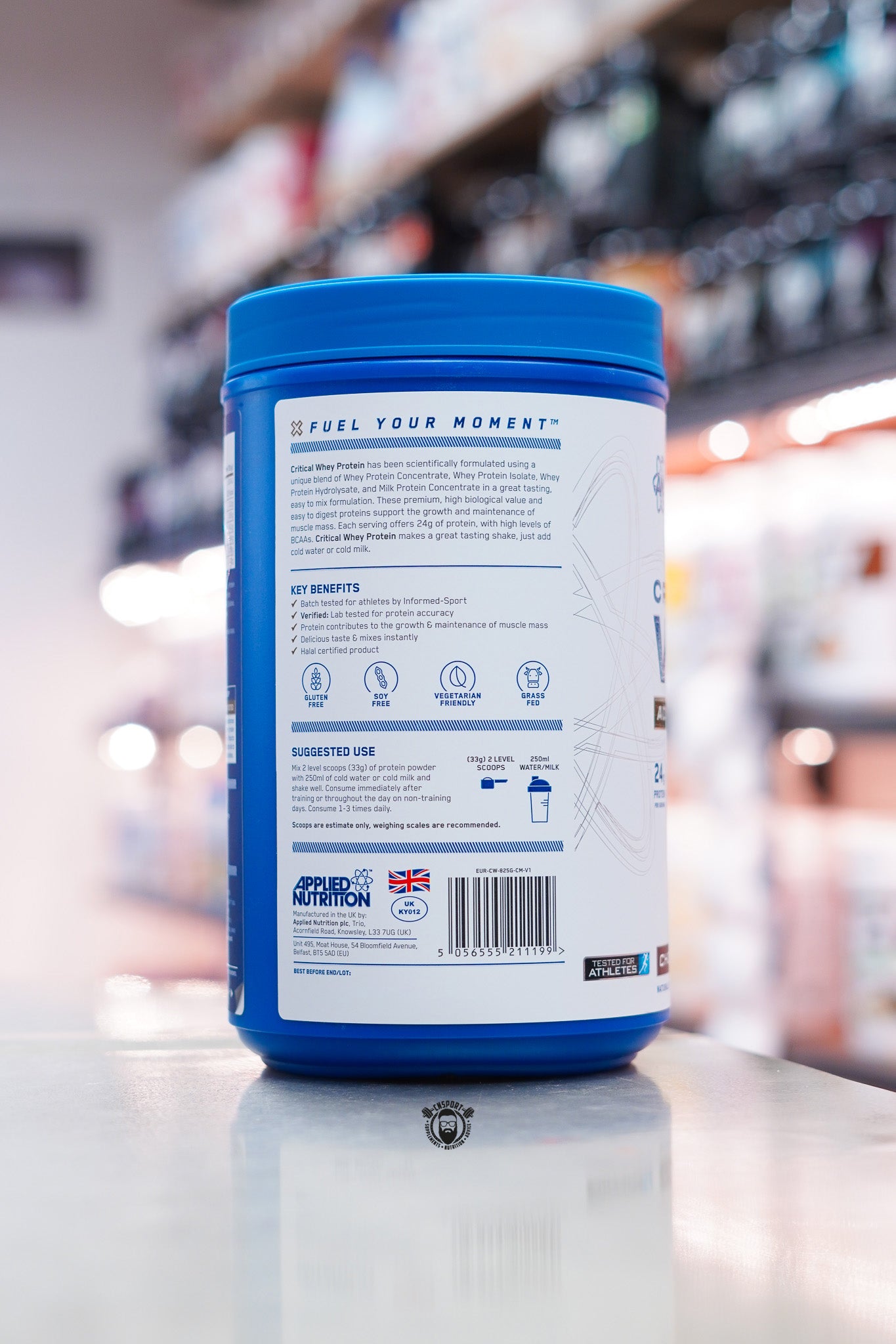 Side panel of Applied Nutrition Critical Whey Advanced Protein showing product overview, key benefits, suggested use and mixing instructions.