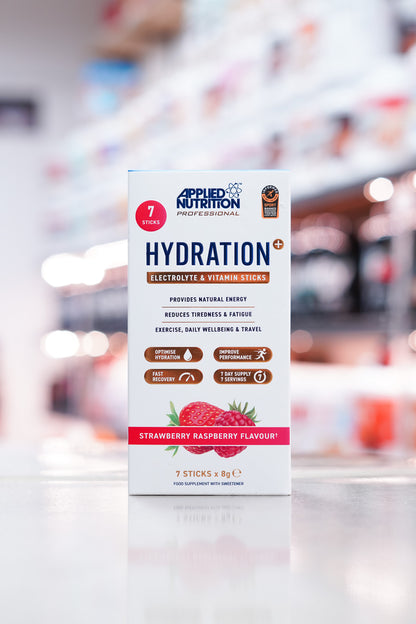 Front of the Applied Nutrition Hydration+ box in Strawberry Raspberry flavour, highlighting key benefits such as natural energy, fatigue reduction, and hydration, with icons for hydration, recovery, performance, and a 7-day supply.
