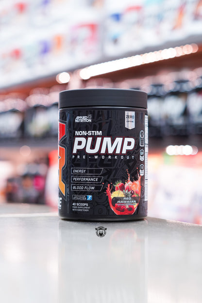 Applied Nutrition ABE Pump non-stim pre-workout tub, Red Hawaiian flavour, 40 servings, displayed on supplement store counter.