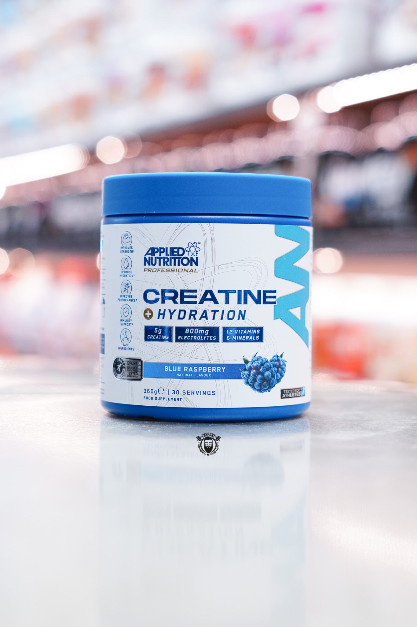 Applied Nutrition Creatine + Hydration supplement in Blue Raspberry flavour, 360g tub with 30 servings, front view showcasing product benefits and ingredients.