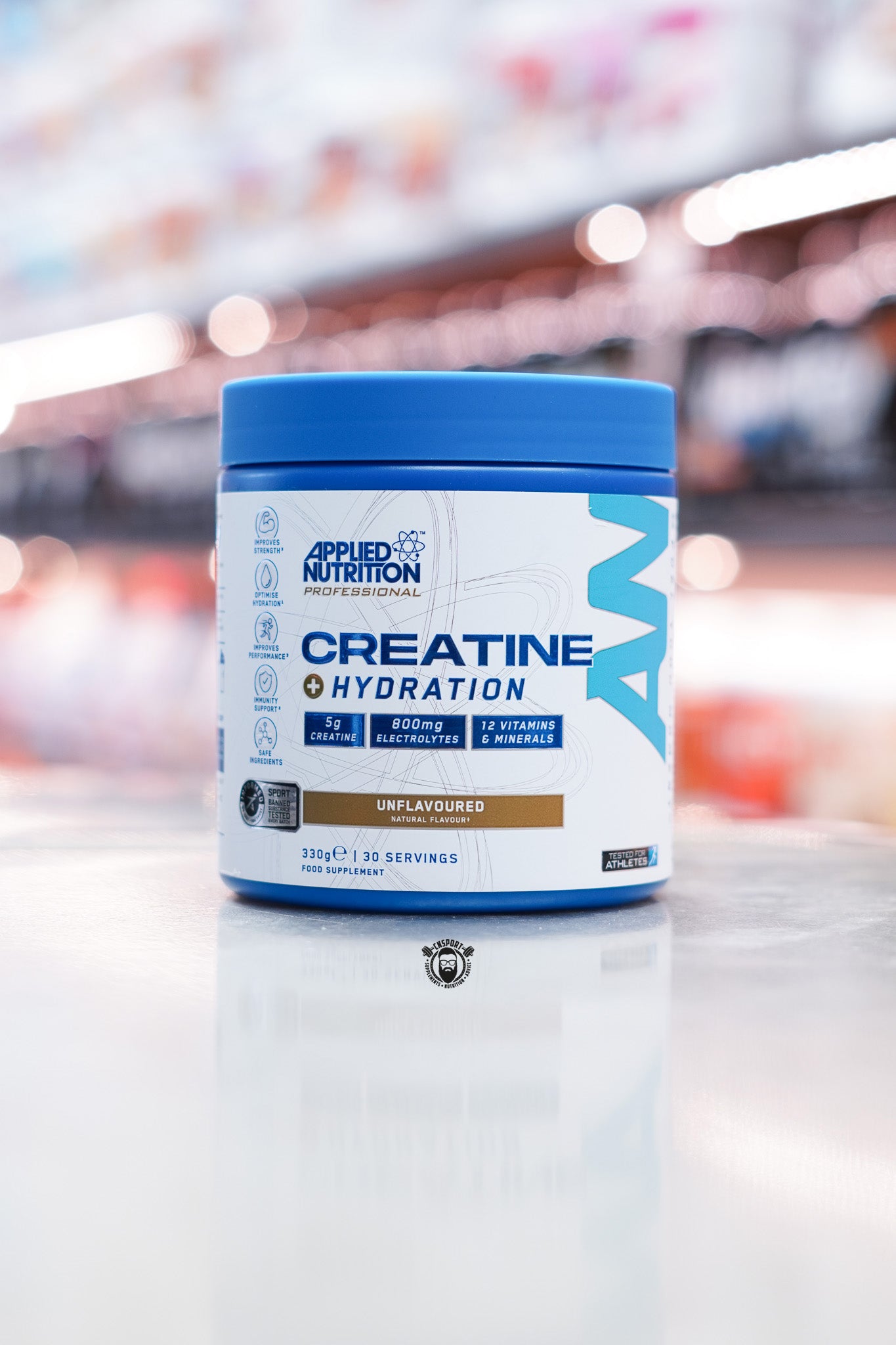 Applied Nutrition Creatine + Hydration unflavoured variant, 330g tub with 30 servings, front view featuring neutral design and main features.