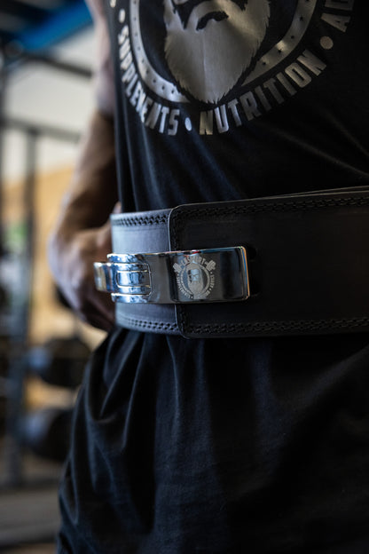 CNSport Lever Belt close-up with polished steel buckle and engraved logo
