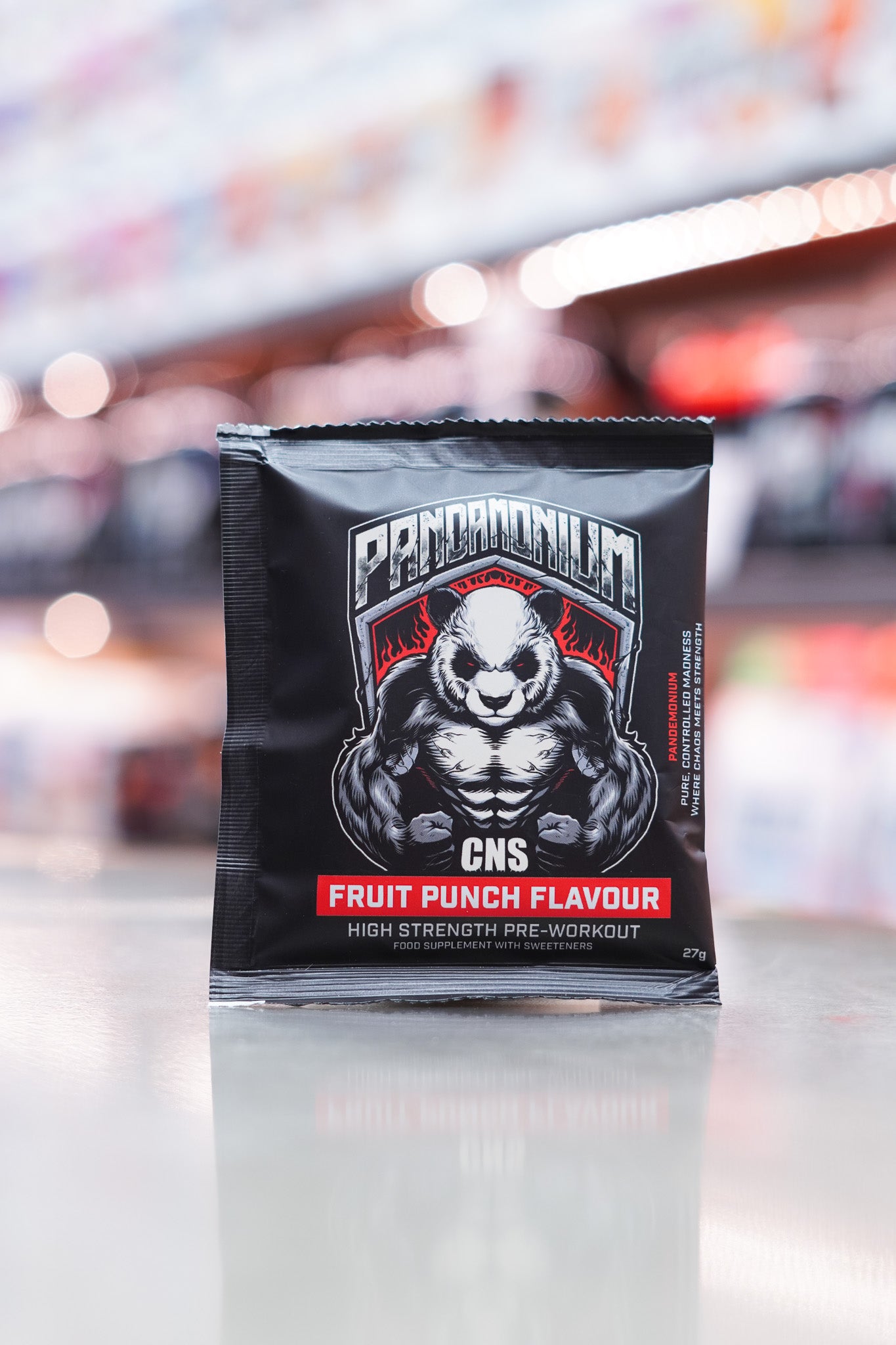 Front view of a CNSport Pandamonium Pre-Workout 27g Fruit Punch flavour sample sachet featuring the muscular panda graphic with red accents and product branding.