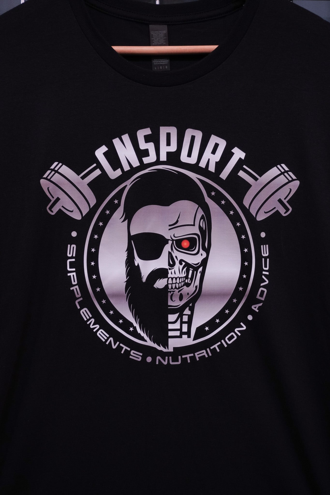 Front close-up of CNSport Terminator T-shirt print with barbell logo and supplements nutrition advice text