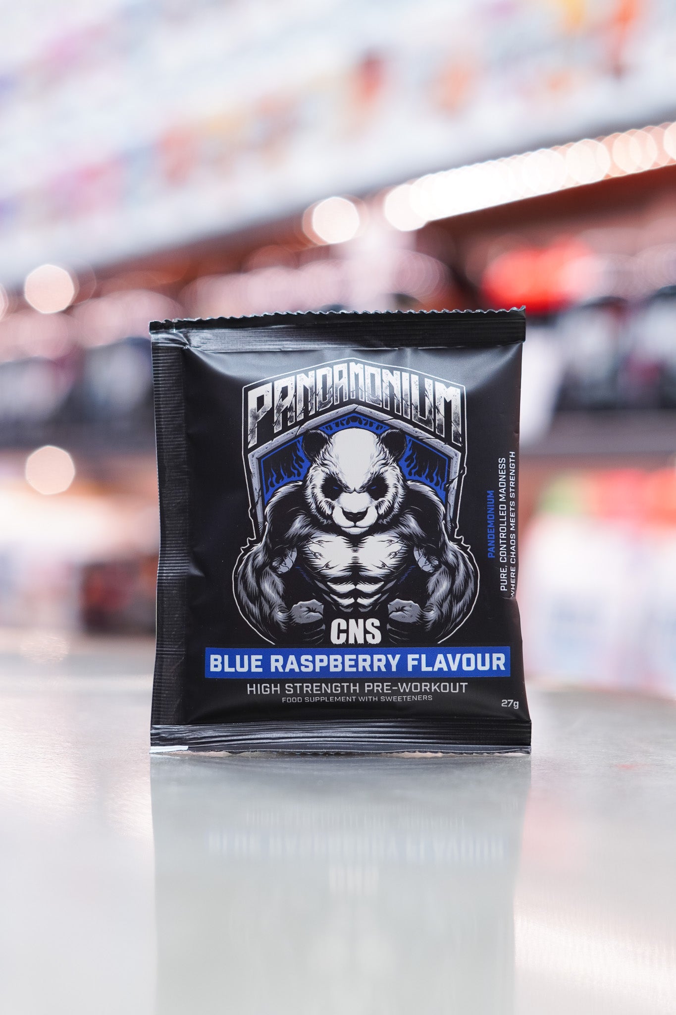 Front view of a CNSport Pandamonium Pre-Workout 27g Blue Raspberry flavour sample sachet featuring the muscular panda graphic with blue accents and product branding.