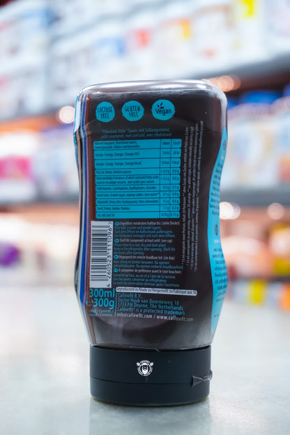 Rear view of Callowfit Chocolate Style Sauce 300ml bottle showing nutritional information, ingredients, barcode and storage instructions on black packaging.