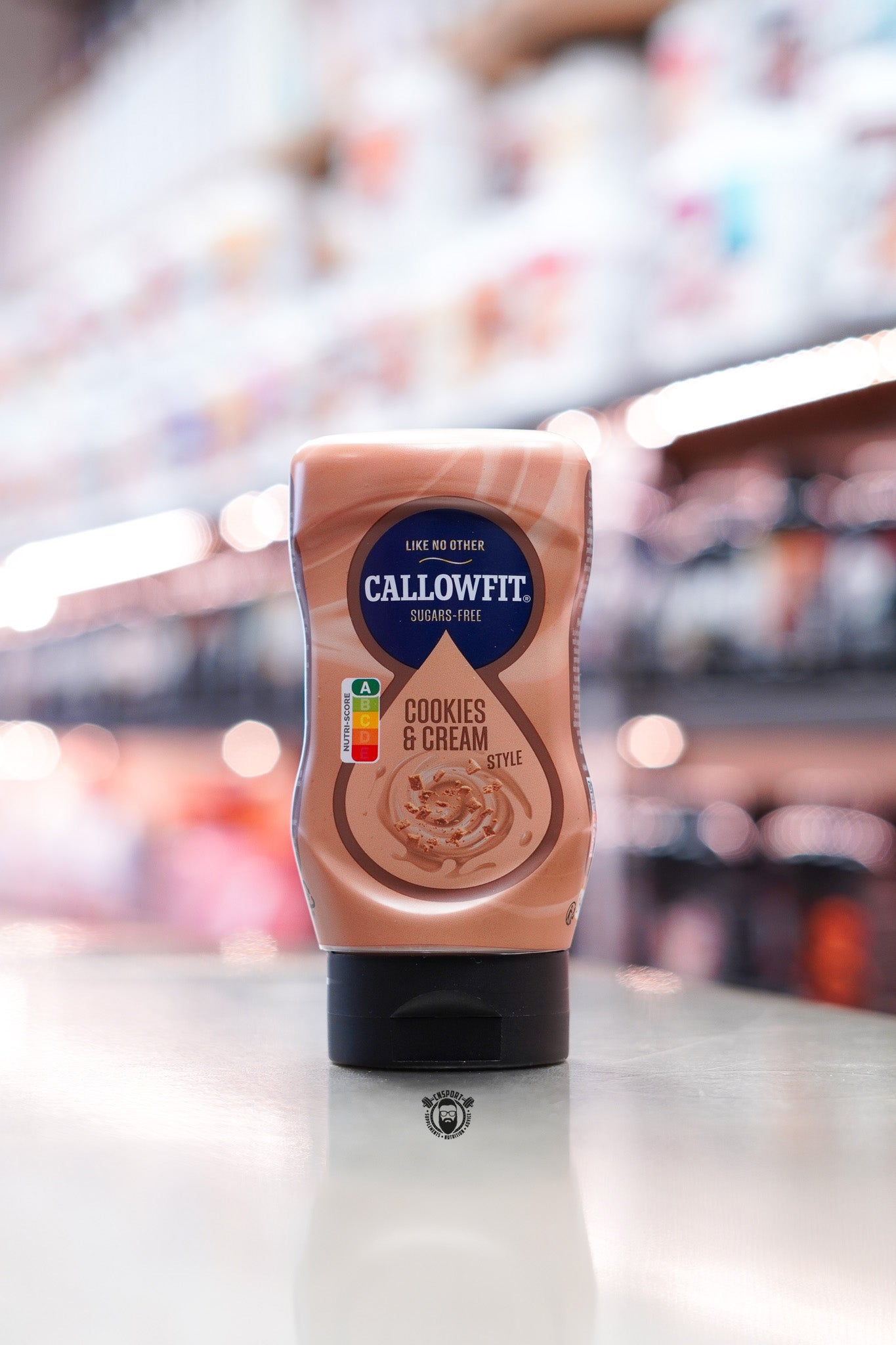 Callowfit Cookies & Cream Style Sauce 300ml sugar-free bottle standing upright with cookies and cream flavour branding in a supplement store.