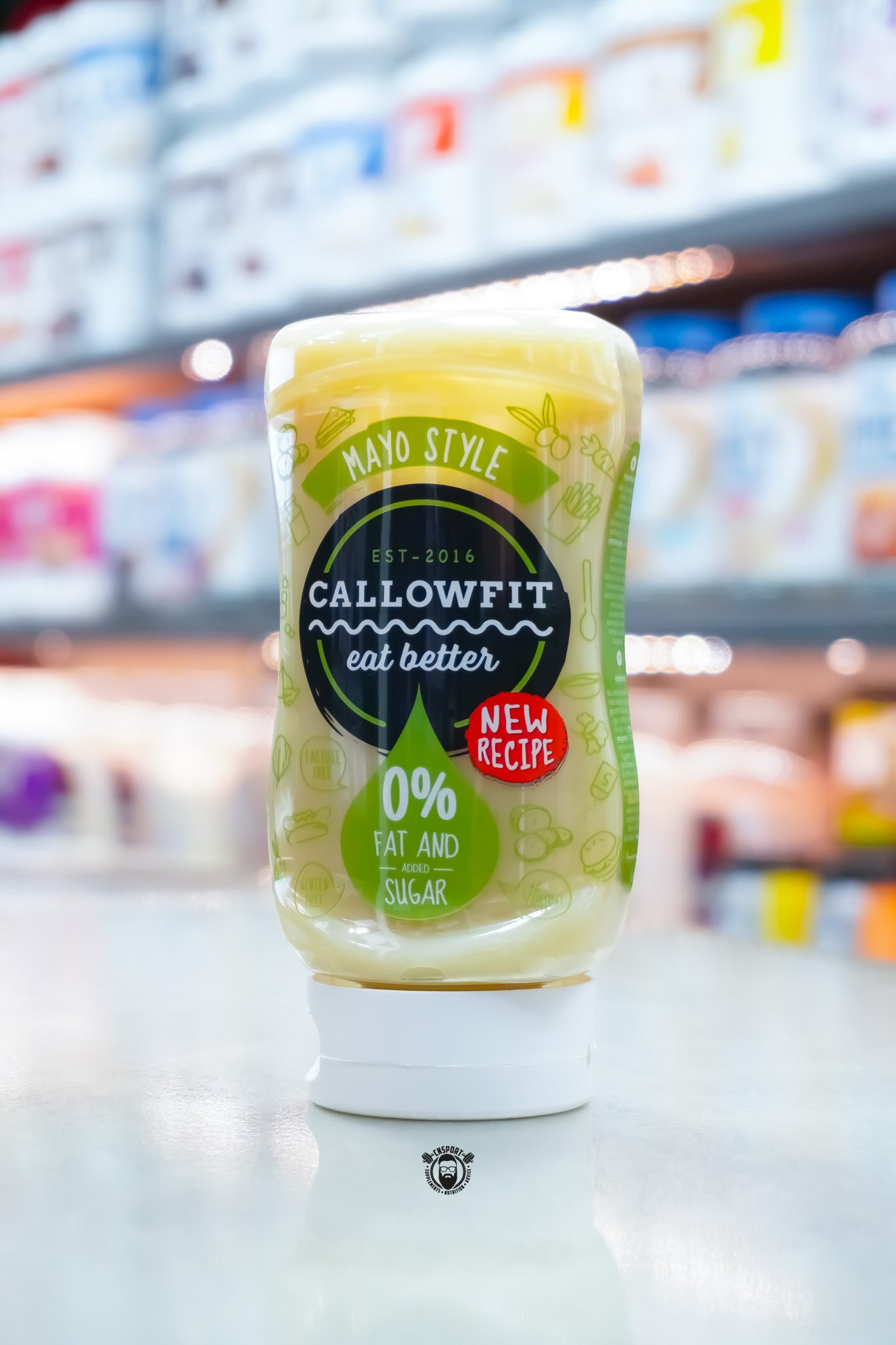Callowfit Mayo Style Sauce 300ml bottle with new recipe label, 0% fat and added sugar branding, displayed upright in a supplement store.