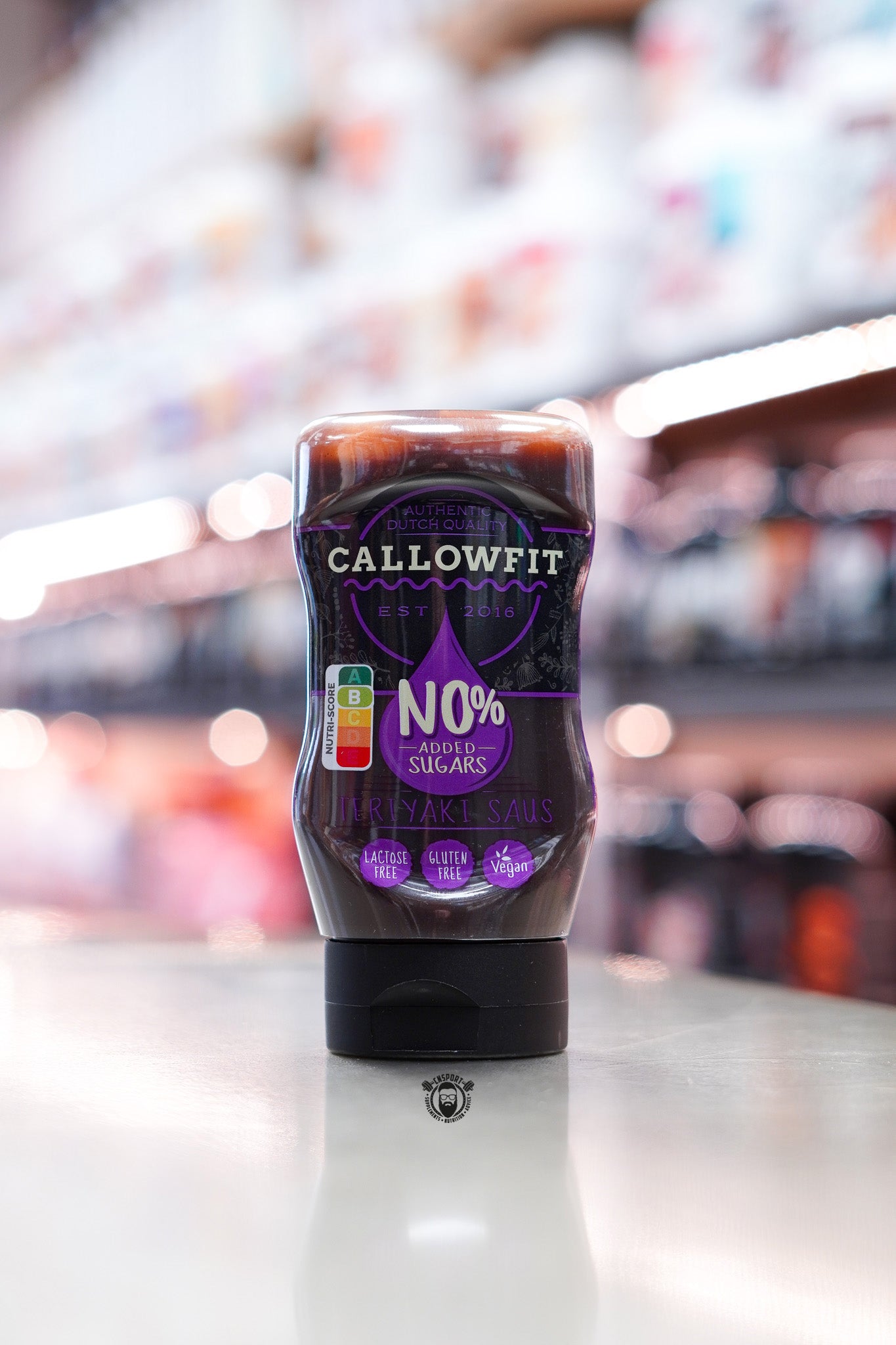 Callowfit Teriyaki Sauce 300ml bottle with no added sugars, lactose-free, gluten-free and vegan-friendly, displayed upright in a supplement store.