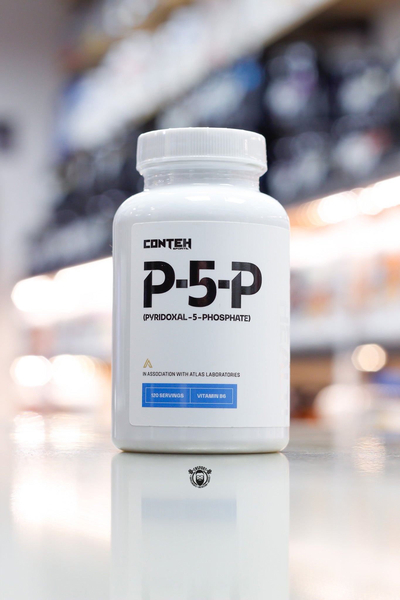 Conteh Sports P-5-P (Pyridoxal-5-Phosphate) Vitamin B6 supplement, 120 servings white bottle front view on supplement store counter.