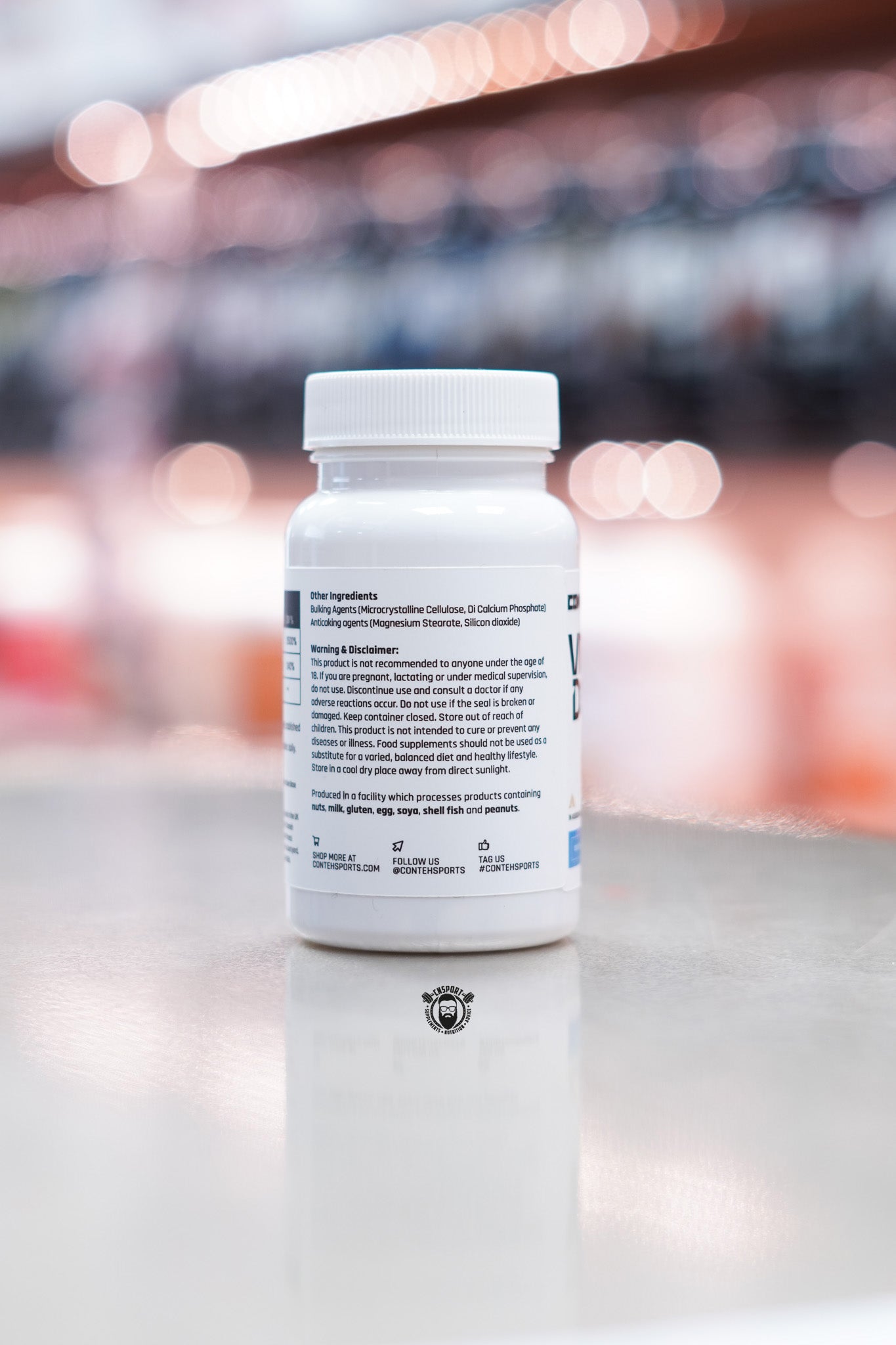 Side label of Conteh Sports Vitamin D3 + K2 supplement bottle – displaying other ingredients, warning and disclaimer, allergen information, and storage instructions.