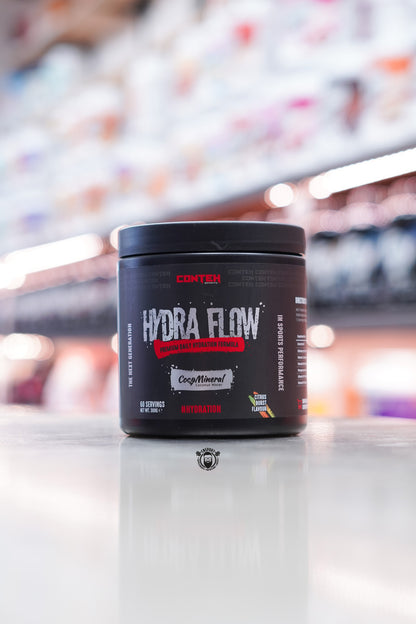 Conteh Sports Hydra Flow hydration drink mix in Citrus Burst flavour – 60 servings, black tub with red and citrus-themed accents, CocoMineral included.