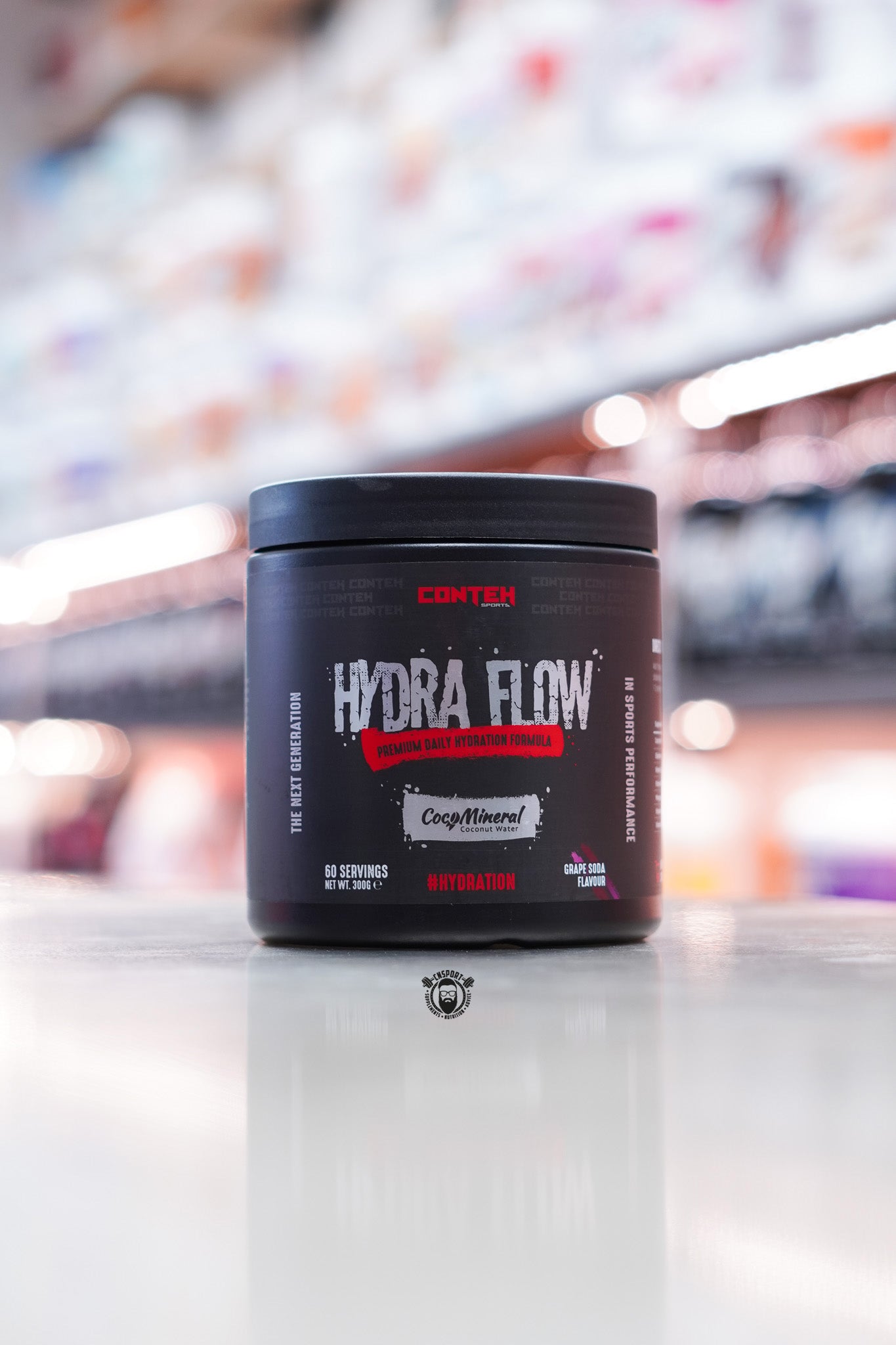Conteh Sports Hydra Flow hydration supplement in Grape Soda flavour – 60 servings per container, displayed with vibrant grape accenting and CocoMineral branding.