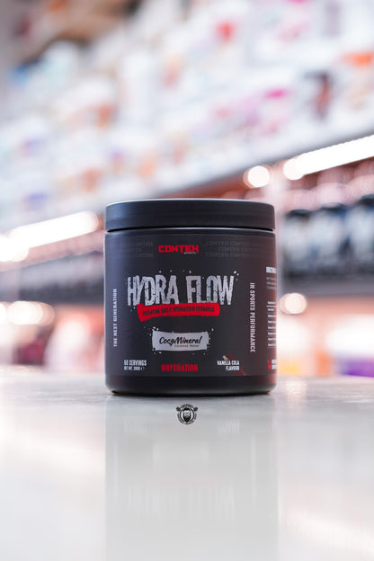 Conteh Sports Hydra Flow hydration mix in Vanilla Cola flavour – 60 servings, cola-themed label on black tub with CocoMineral coconut water branding.
