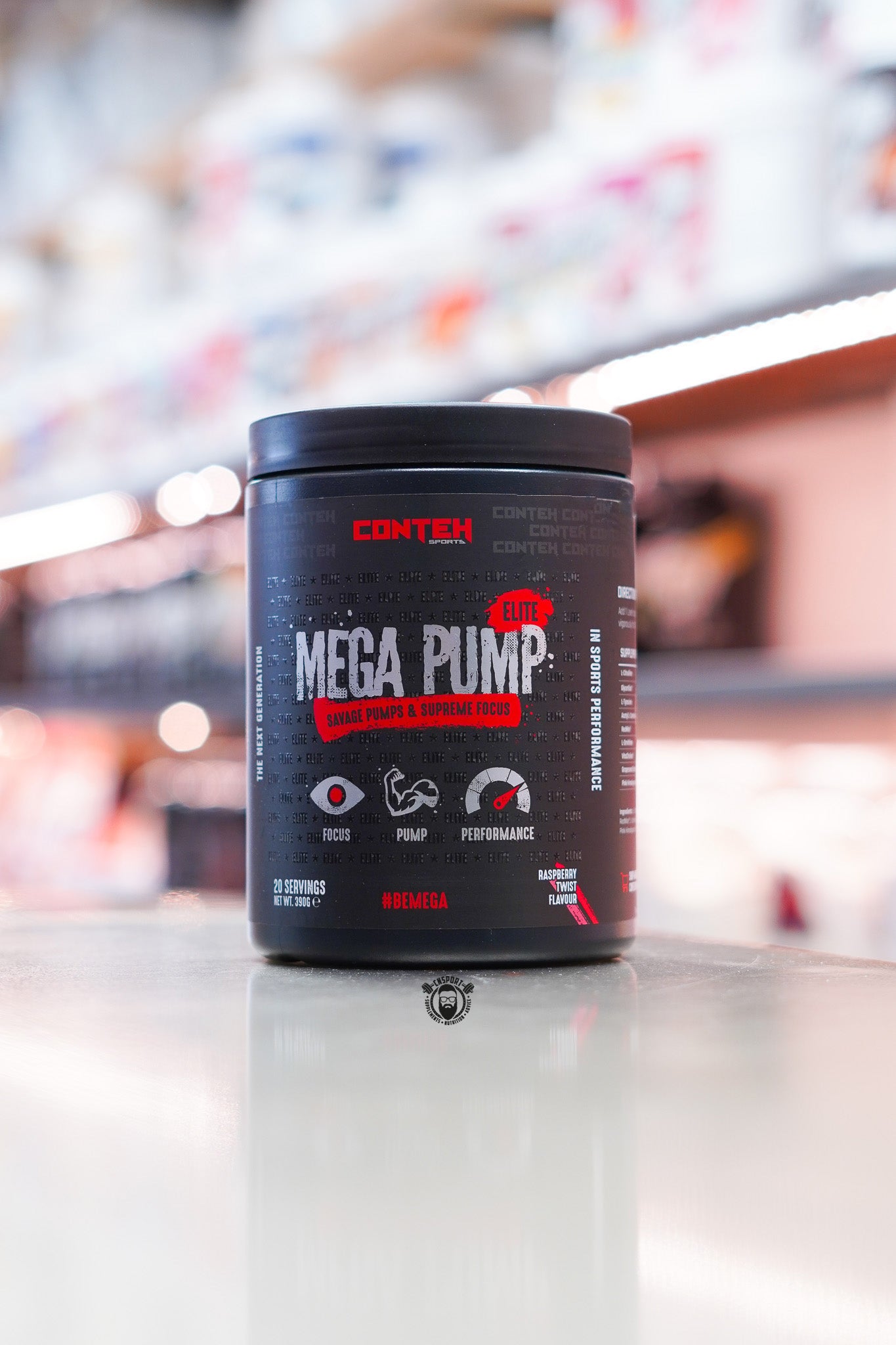 Conteh Sports Mega Pump Elite pre-workout tub, Raspberry Twist flavour, displayed on supplement store counter.
