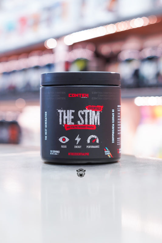 Conteh Sports The Stim Essentials high-stim pre-workout tub, Tropical flavour, 30 servings, displayed on supplement store counter.