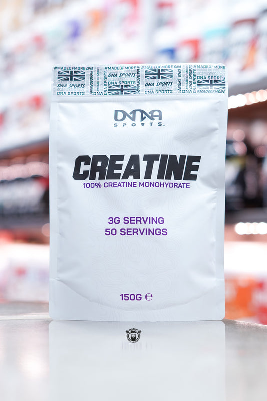 Front-facing image of DNA Sports Creatine Monohydrate 150g pouch displaying bold black and purple text with serving information and minimalist packaging.
