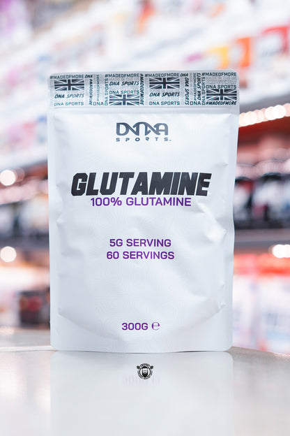 Front of a DNA Sports Glutamine 300g pouch with a clean white design, DNA Sports logo, ‘Glutamine 100% Glutamine’ text in bold black and purple lettering, and serving details stating 5g per serving and 60 servings.