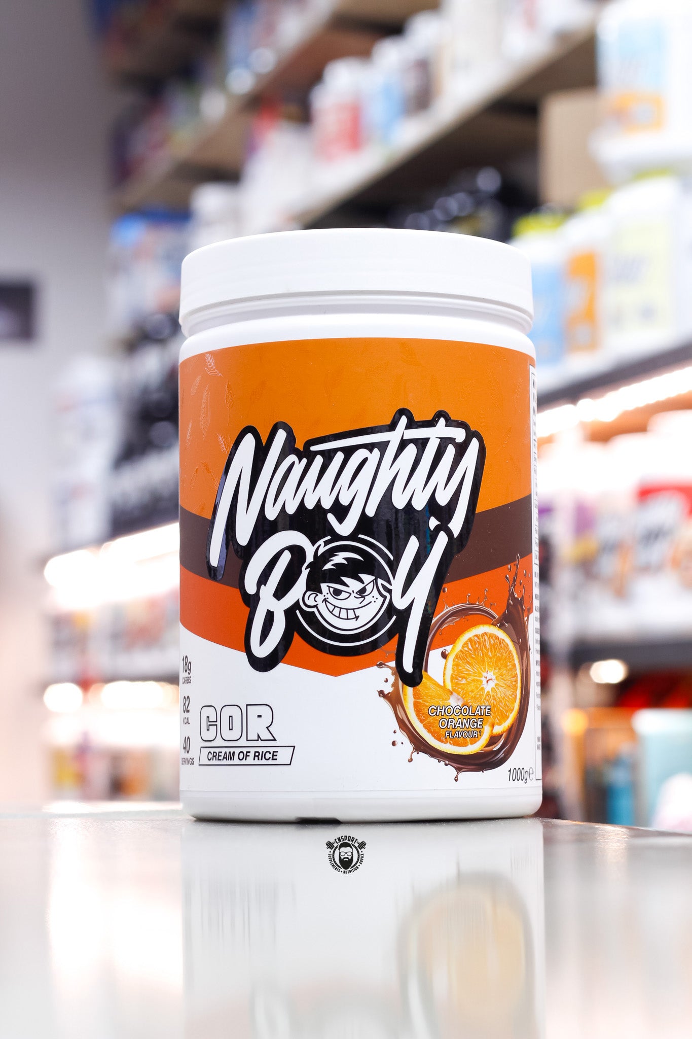 1kg Naughty Boy COR Cream of Rice in Chocolate Orange flavour, featuring an orange and chocolate-themed label with a juicy orange slice illustration.
