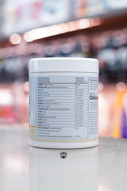 Close-up of the nutritional information panel on Olimp Collagen powder, listing active ingredients including 5000 mg fish collagen, 10 mg hyaluronic acid, and essential vitamins and minerals.