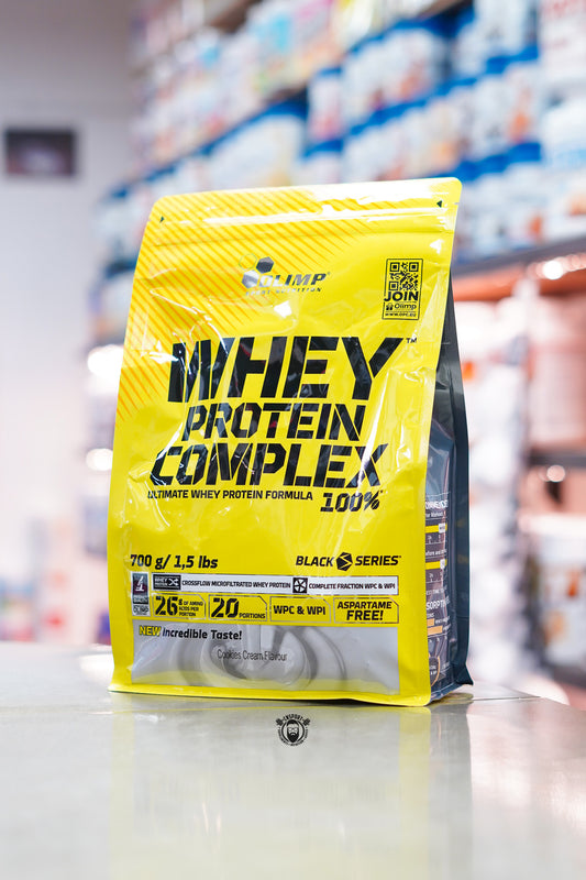 Olimp Whey Protein Complex Cookies and Cream 700g pouch showing product features