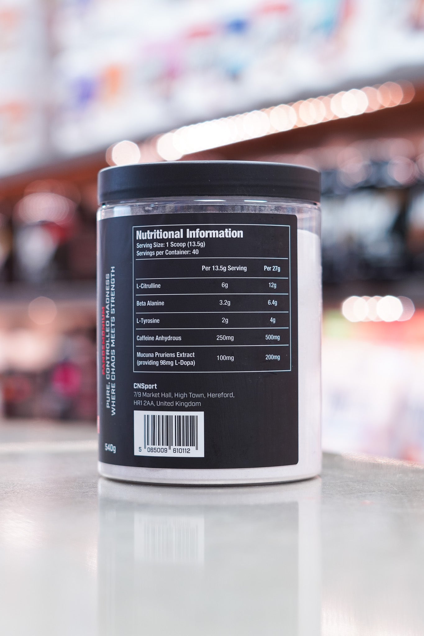Close-up of CNSport Pandamonium Pre-Workout Fruit Punch flavour showing detailed nutritional information panel with ingredient dosages and serving size.