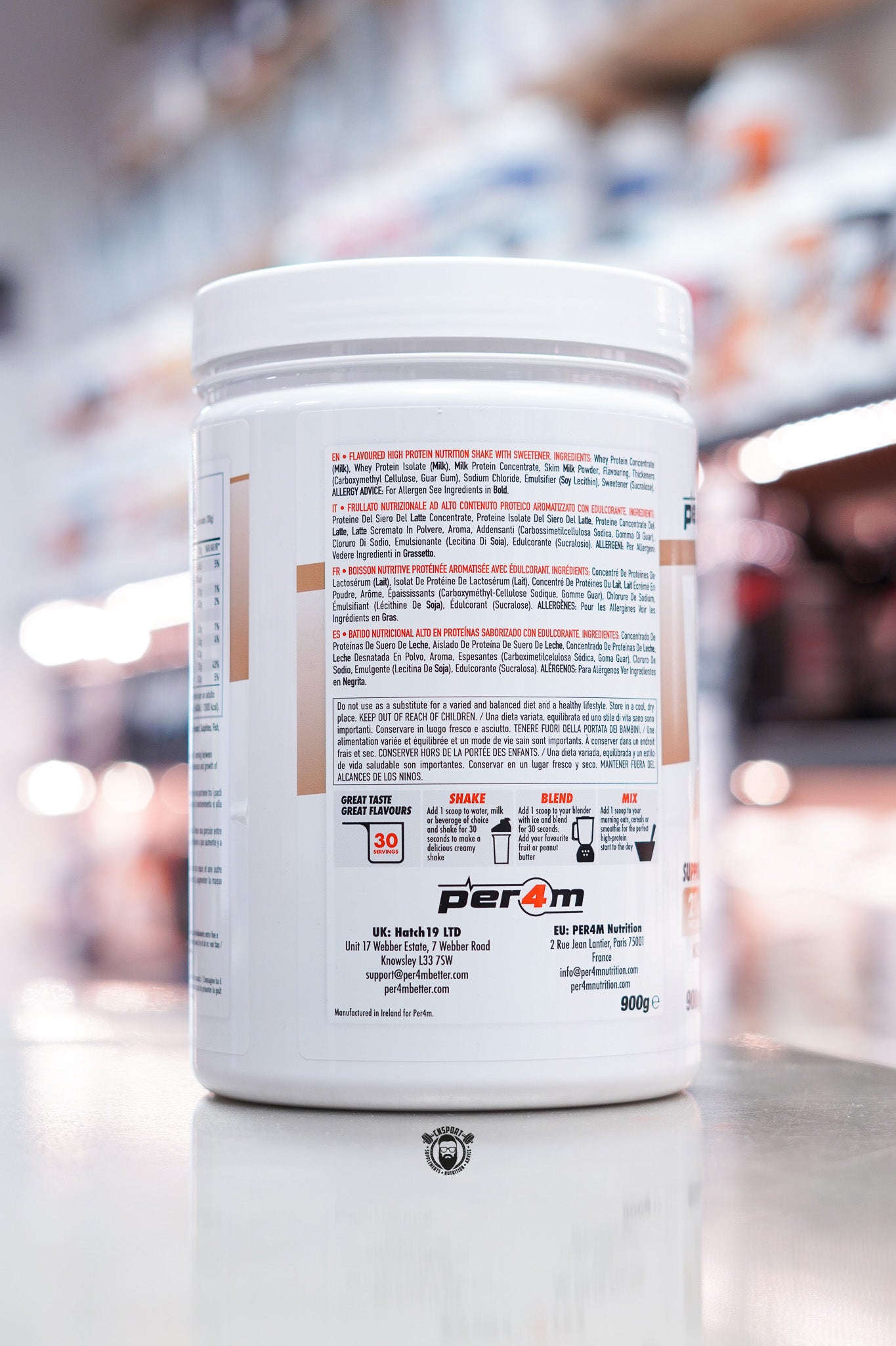 Per4m Whey Advanced Protein White Chocolate 900g tub showing ingredients list and product details on side label.