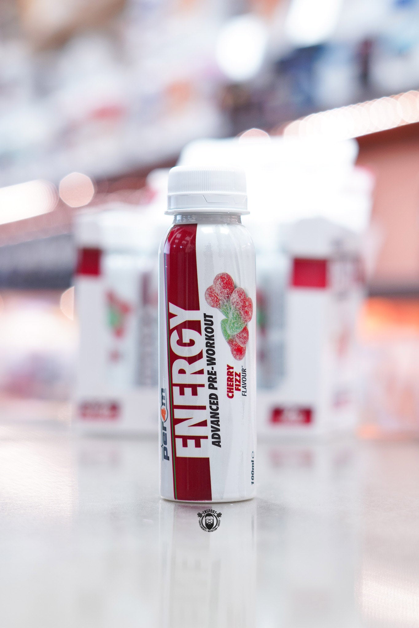 Front-facing image of Per4m Energy Pre-Workout Shot Cherry Fizz flavour bottle with red design and cherry candy artwork.
