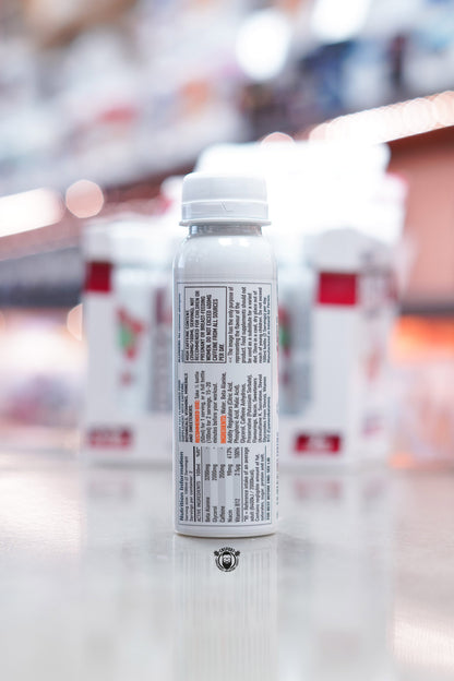 Close-up of Per4m Energy Pre-Workout Shot Cherry Fizz label showing nutritional information and ingredient details.