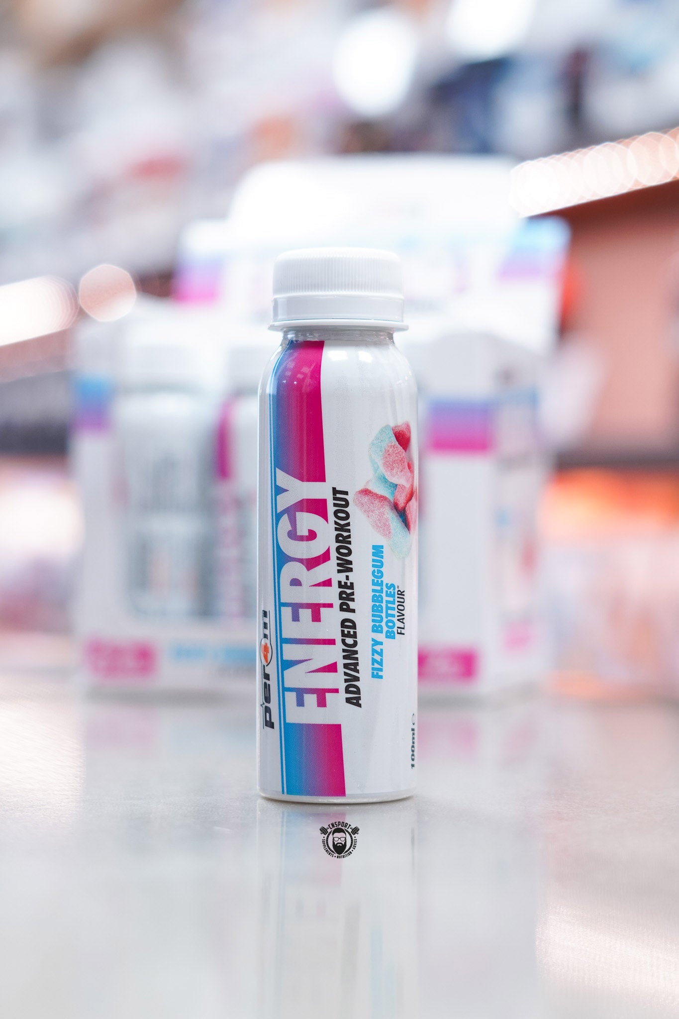 Front view of Per4m Energy Pre-Workout Shot Fizzy Bubblegum Bottles flavour bottle featuring pink and blue label design with candy imagery.