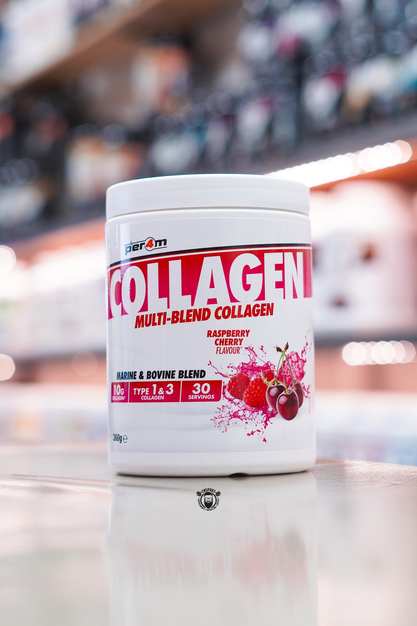 Per4m Multi-Blend Collagen powder, Raspberry Cherry flavour, featuring marine and bovine collagen with 10g collagen per serving, displayed on a supplement store counter.