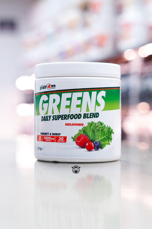 Per4m Greens daily superfood blend powder, unflavoured, 30 servings tub on supplement store counter.