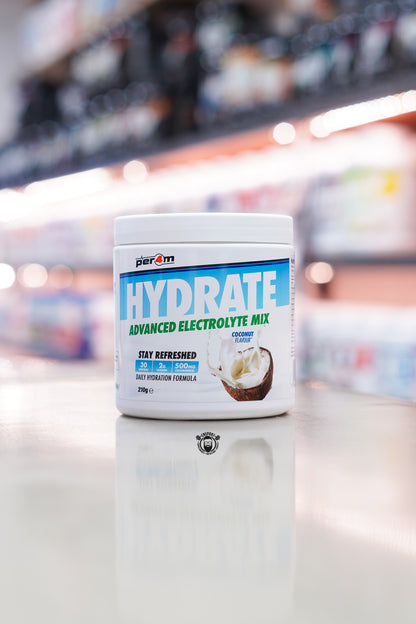 Per4m Hydrate Advanced Electrolyte Mix Coconut flavour tub with 30 servings displayed on a supplement store counter.