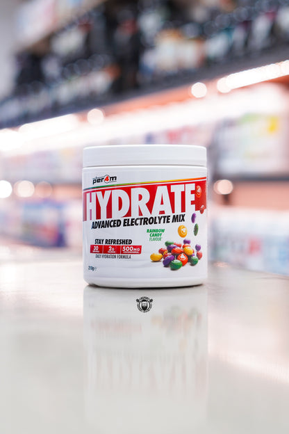 Per4m Hydrate Advanced Electrolyte Mix Rainbow Candy flavour tub with 30 servings displayed on a supplement store counter.