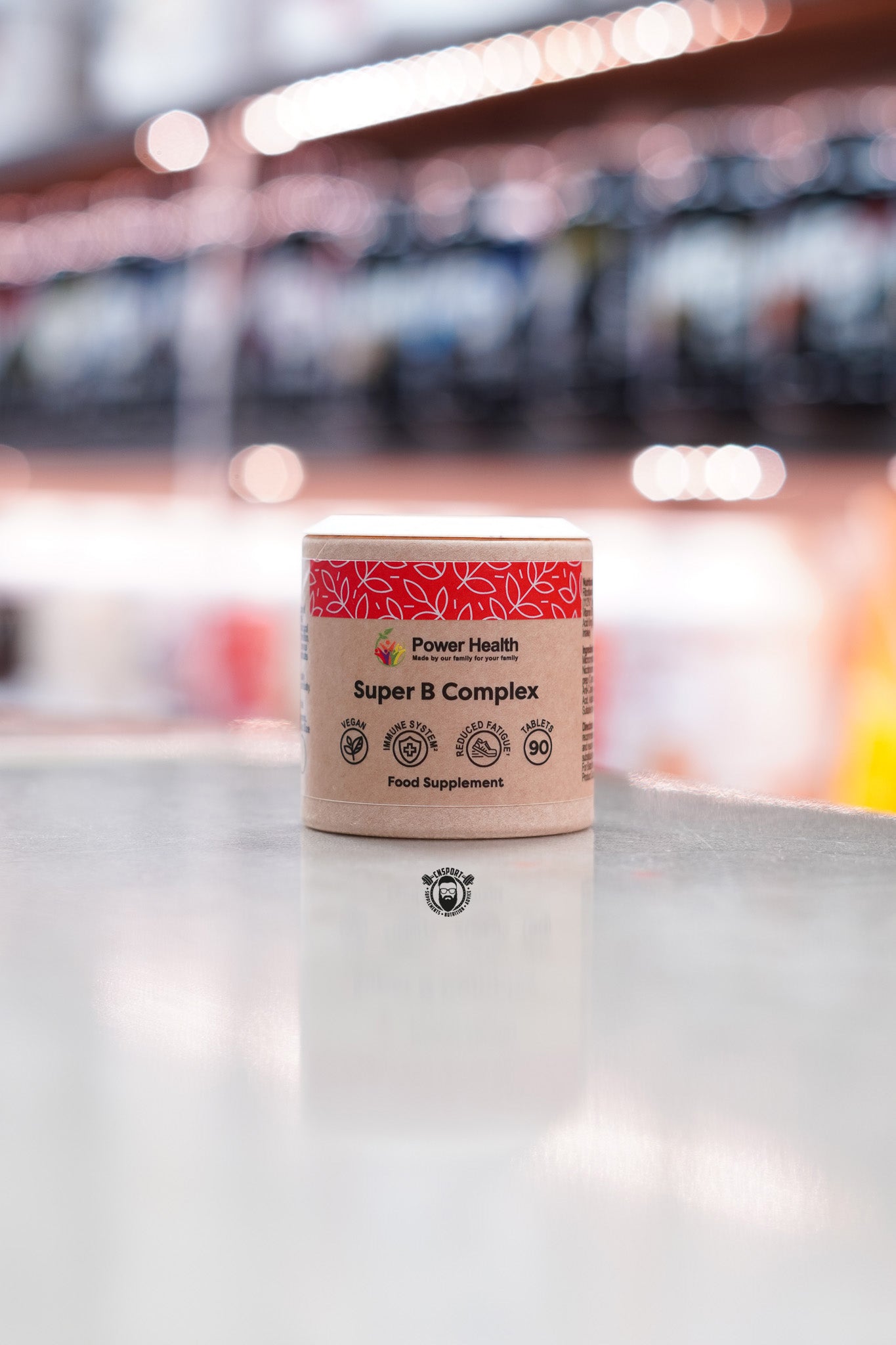 Front-facing image of Power Health Super B Complex supplement with vegan, immune support, and reduced fatigue icons on kraft-style packaging.